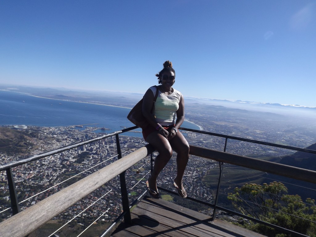 Sitting on the ledge of Table Mountain in Cape Town, South Africa, taking it all in on breath at a time.