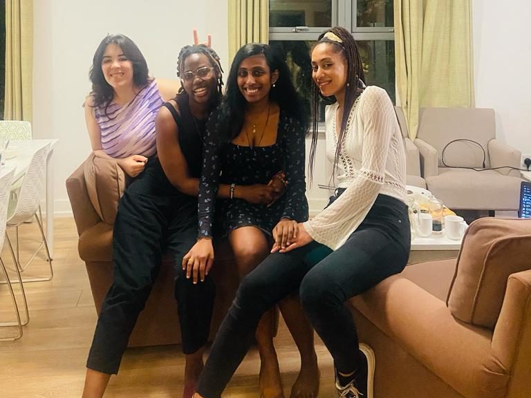 Wairimū and her roommates posing for a photo in their shared accommodation