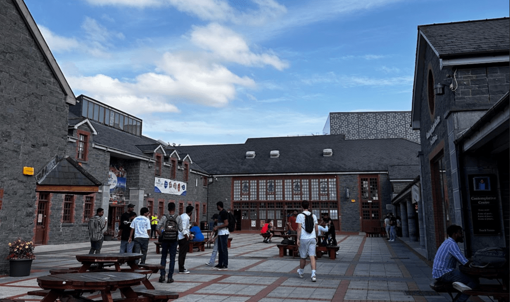 The student courtyard at the University of Limerick full of students talking and hanging out