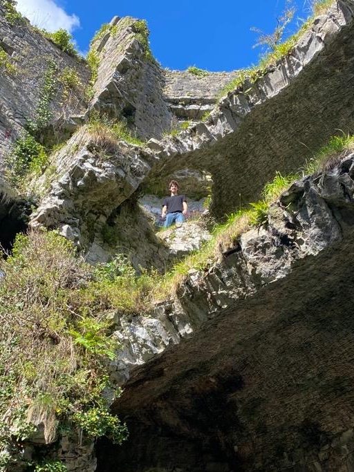 Charlie standing on old Mill ruins by UL