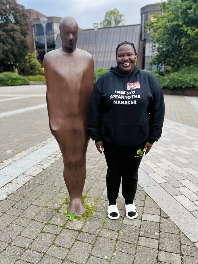 Lucy posing with Brown Thomas (The together and apart statue created by Anthony Gromley)