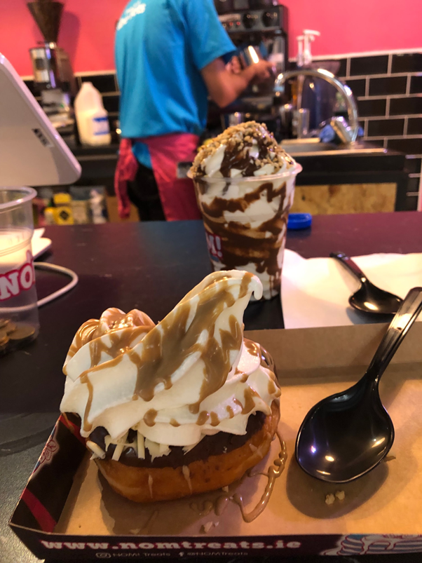 Vanilla ice cream on a donut.