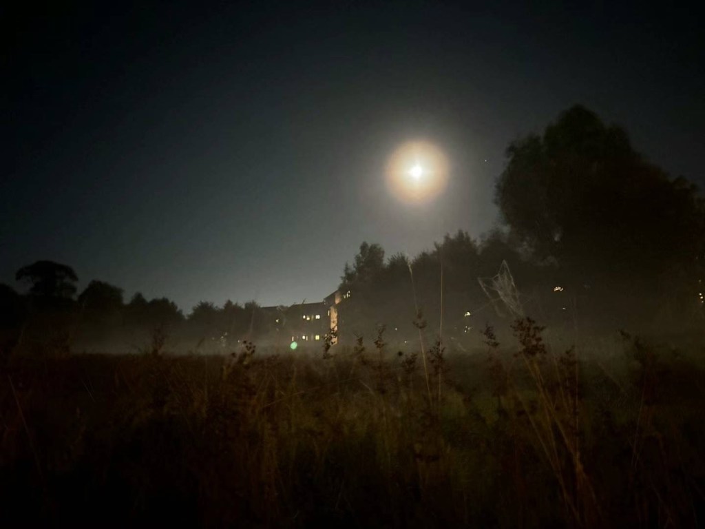 The full moon over a foggy Dromroe student village
