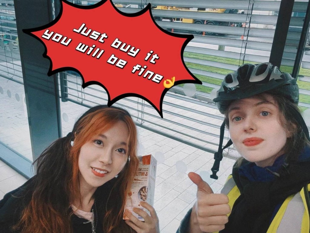 Niri and her friend with a 'Just buy it you will be fine' sticker over them