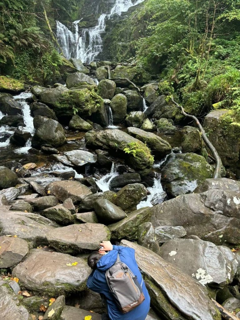 Niri's friend taking photos of Torc Waterfall