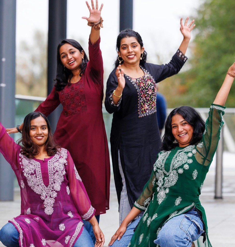 4 UL students in traditional Indian clothing posing for Diwali