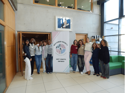 WISTEM Soc women posing with a pullup for their society