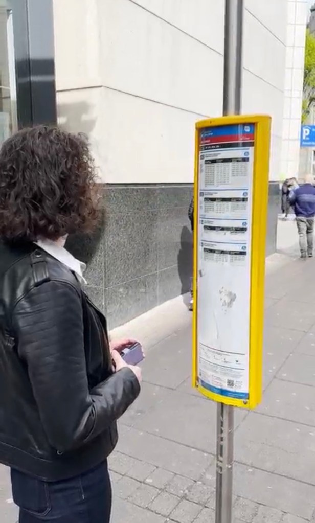 Student outside bus stop