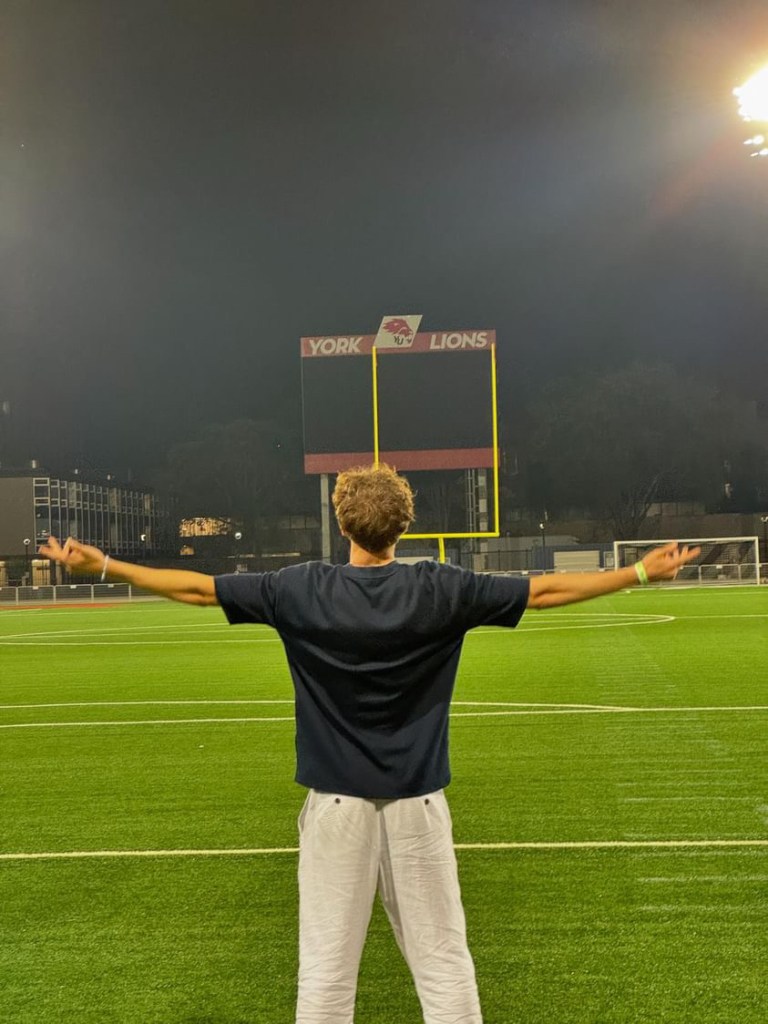 Cian looking over a football pitch