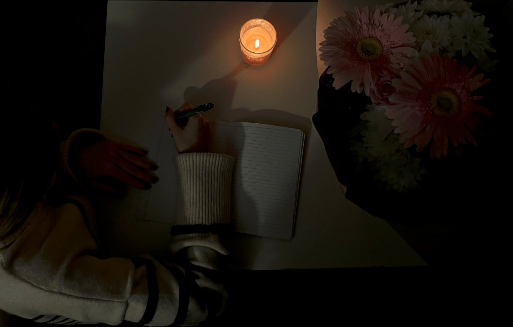 A girl writing on a journal