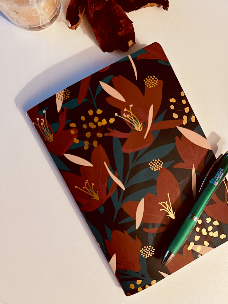 A journal with a floral pattern
