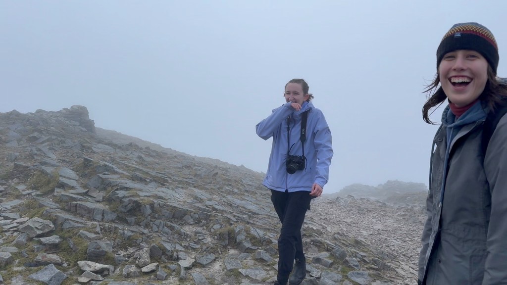 Lily's friends laughing while walking the path
