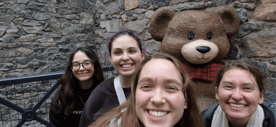 Vanessa and friends posing with a bear figure