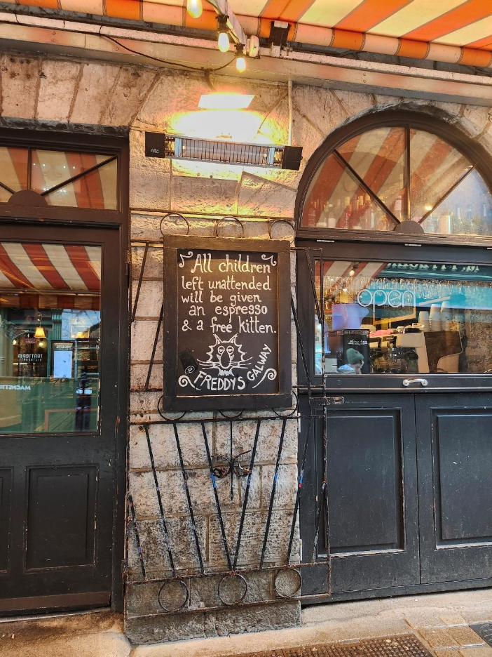 A pub's inscription saying: 'All children left unattended will be given an espresso and a free kitten'