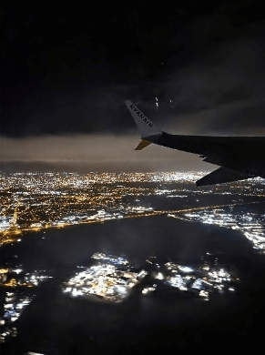 A nighttime shot from a plane of city lights