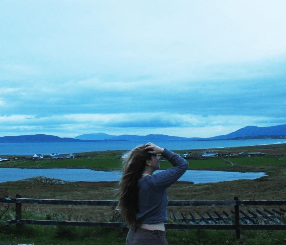 A girl staring at a landscape