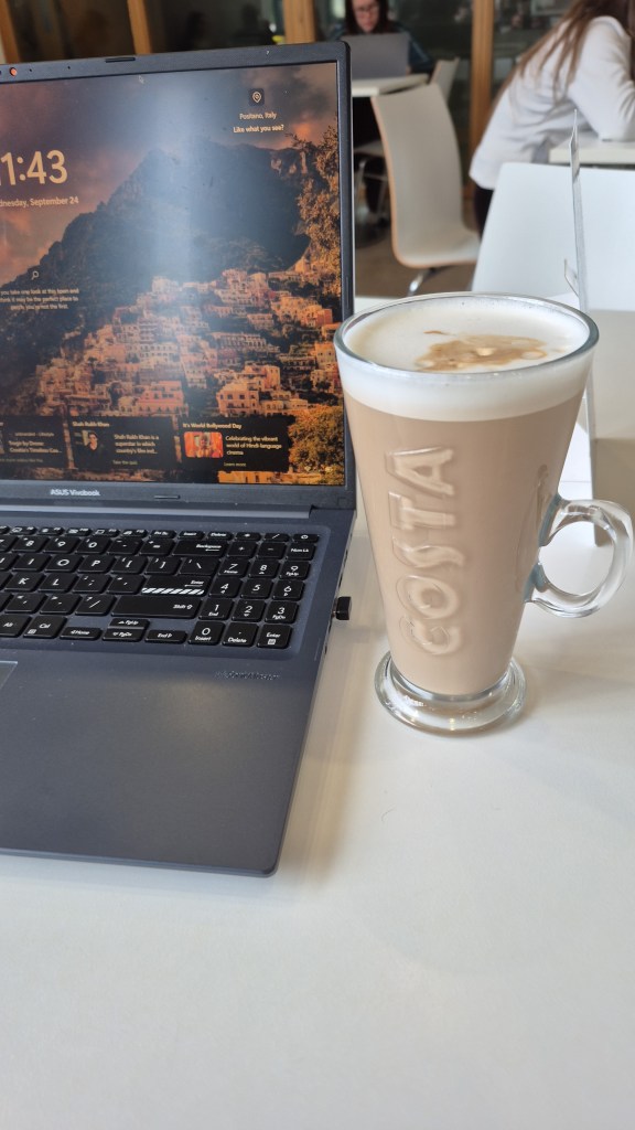 A coffee from Costa and a laptop