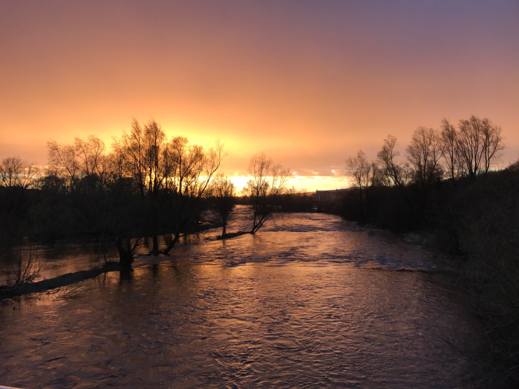 An orange sunset over the River Shannon