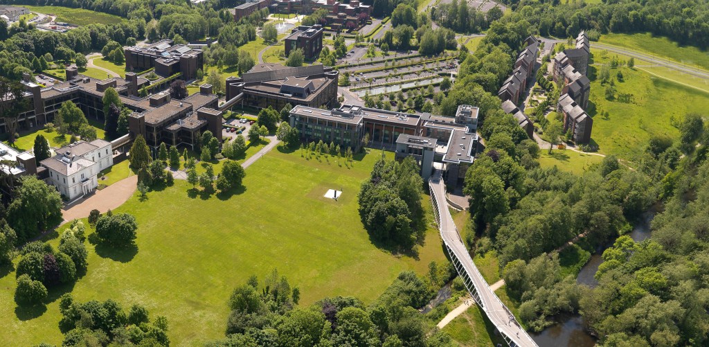 An aerial view of Plassey House and the living bridge on a sunny day