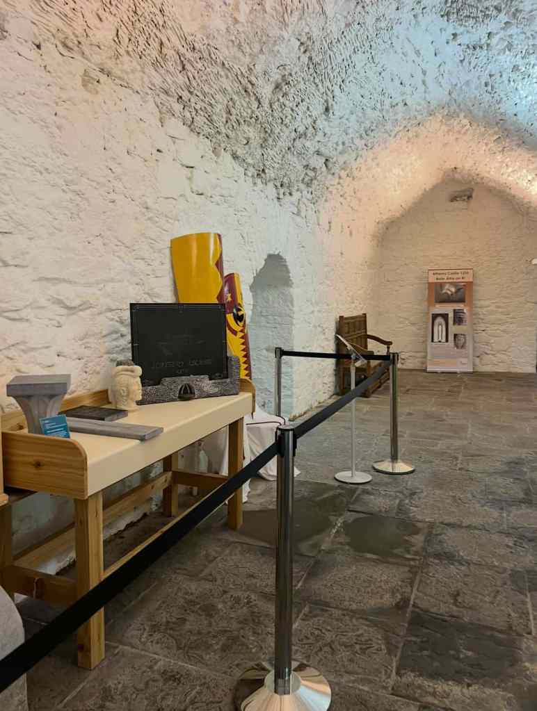 The image shows an interior exhibit space at Athenry Castle in County Galway, Ireland. 
