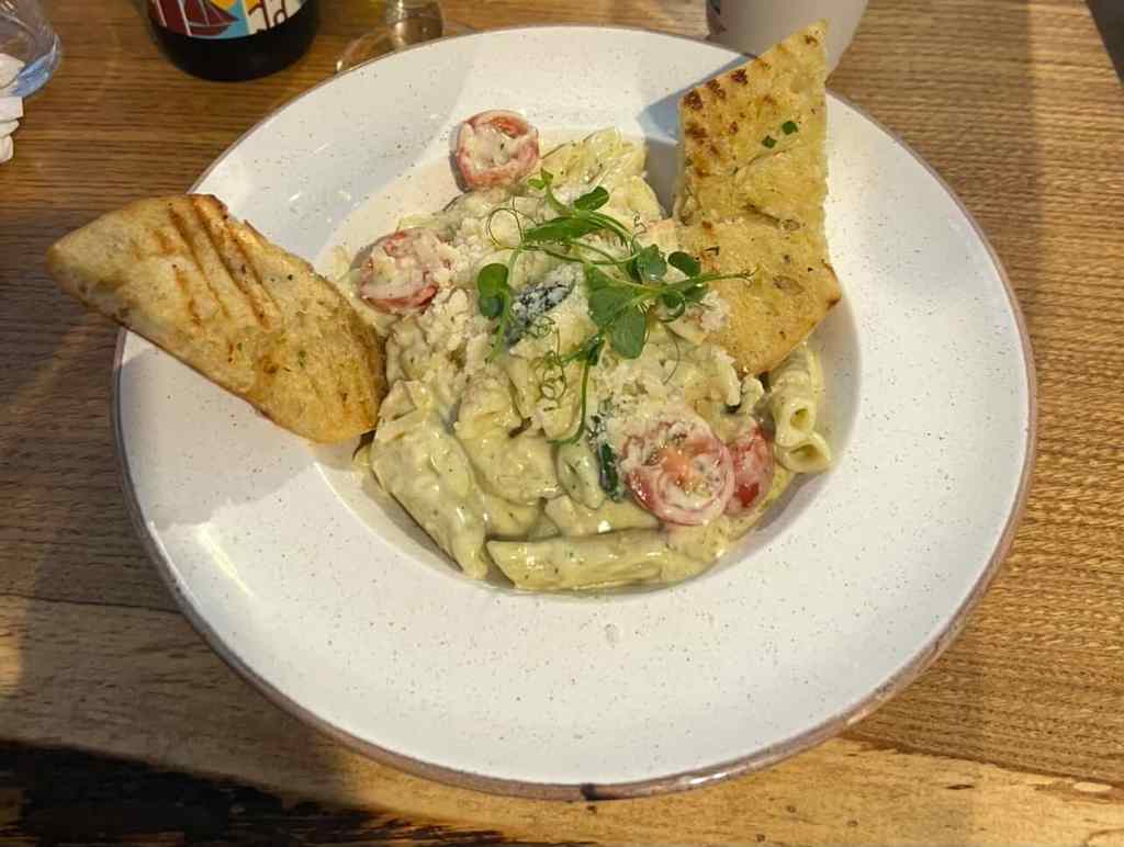 Image showing pasta with creamy cheese sauce and parmesan which  Finn got for lunch in a restaurant known as the Old Barracks.