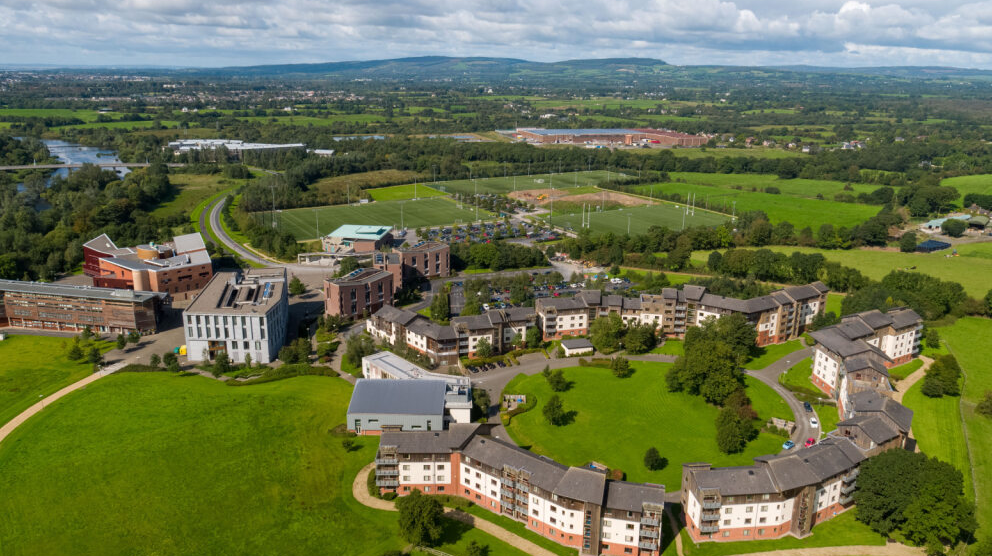 Aerial view of Plassey Residence Village at the University of Limerick, featuring green spaces and student apartments.