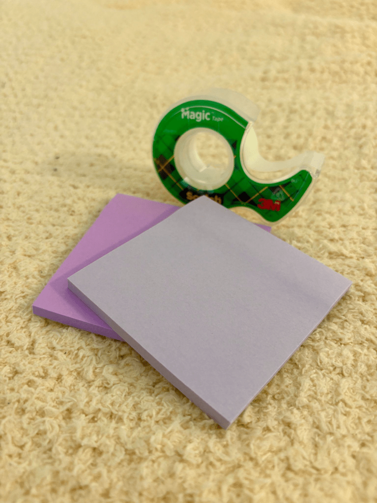 Image of Katies purple sticky notes and a green mini sellotape.