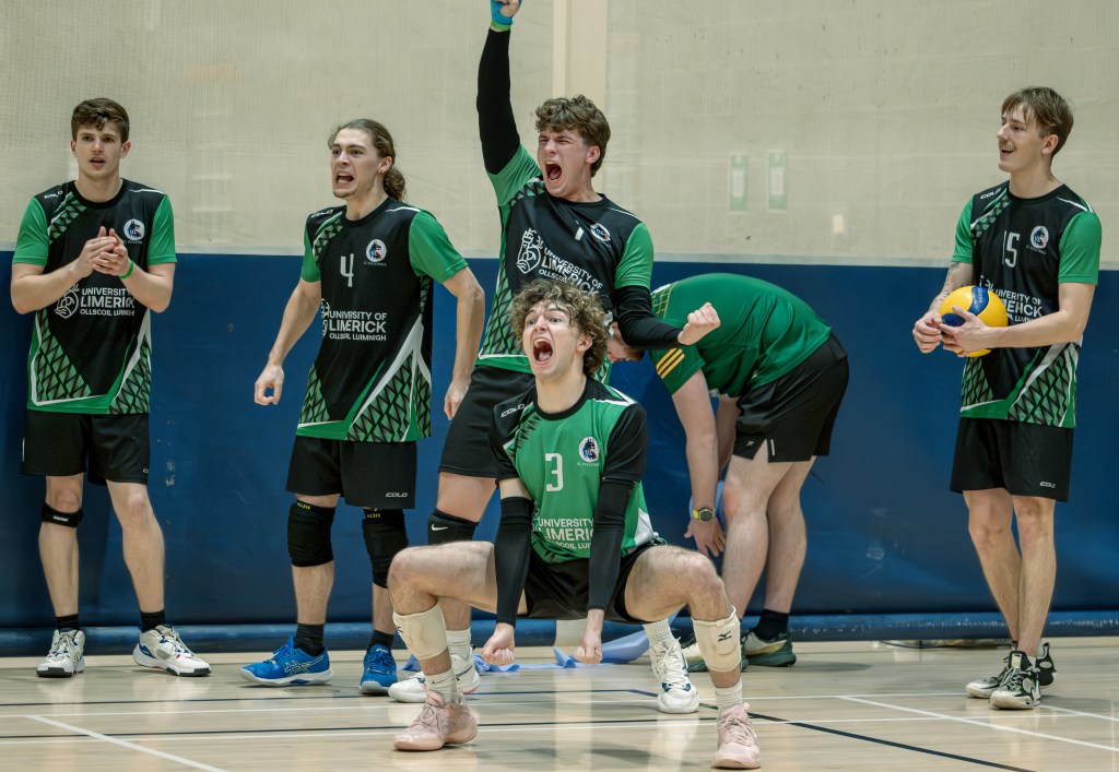Image of Maddox and his teammates celebrating on the court.