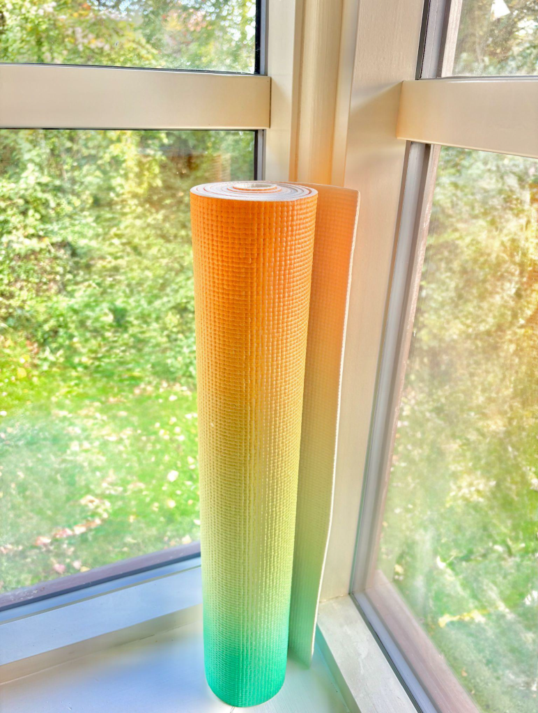 Image of Katies rainbow coloured yoga mat.