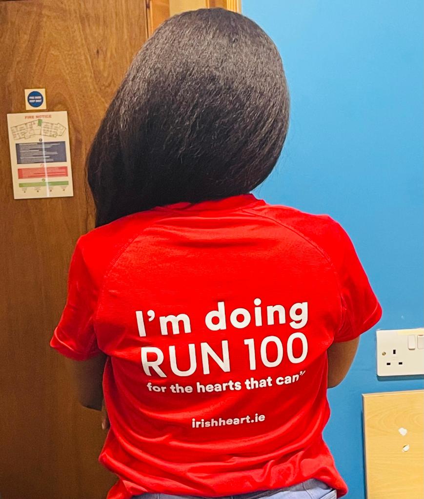 Mariama's Irishheart.ie red tshirt that says I'm doing RUN 100 for the hearts that can't