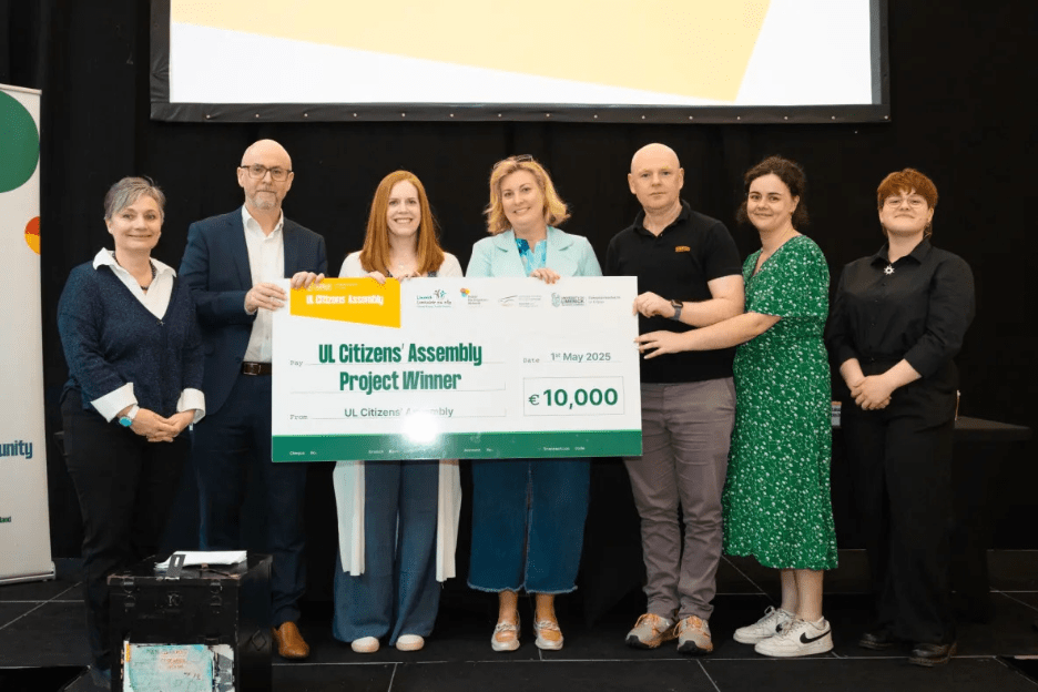 Photo of ARISE members with their project winner cheque